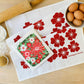 Red Flowers Tea Towel + Poinsettia Swedish Dishcloth Bundle